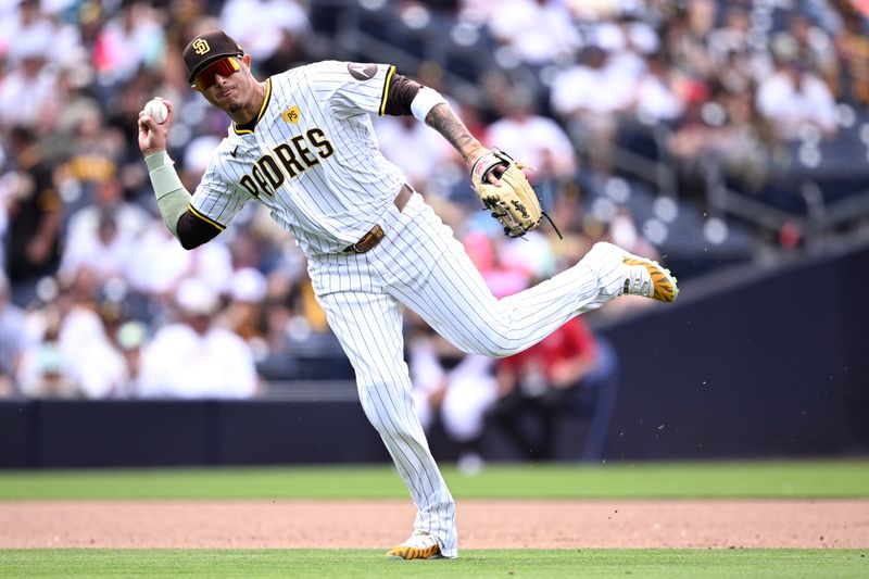 May 1, 2024; San Diego, California, USA; San Diego Padres third baseman Manny Machado (13) throws to first base on a ground out by Cincinnati Reds second baseman Jonathan India (not pictured) during the ninth inning at Petco Park. Mandatory Credit: Orlando Ramirez-USA TODAY Sports