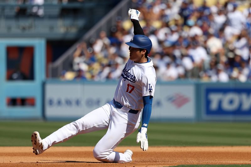 Sep 22, 2024; Los Angeles, California, USA;  Los Angeles Dodgers designated hitter Shohei Ohtani (17) steals second base during the third inning against the Colorado Rockies at Dodger Stadium. Mandatory Credit: Kiyoshi Mio-Imagn Images