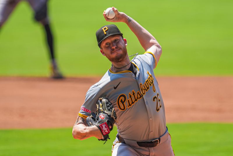 Jun 30, 2024; Cumberland, Georgia, USA; Pittsburgh Pirates starting pitcher Bailey Falter (26) pitches against the Atlanta Braves during the first inning at Truist Park. Mandatory Credit: Dale Zanine-USA TODAY Sports