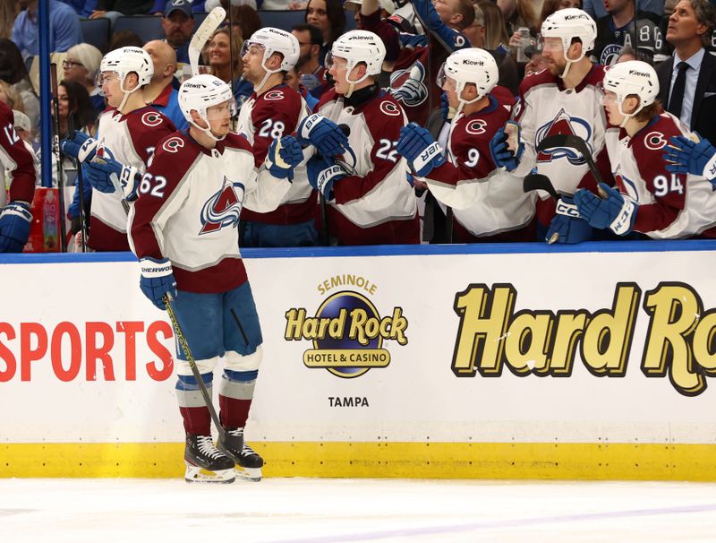 Feb 15, 2024; Tampa, Florida, USA; Colorado Avalanche left wing Artturi Lehkonen (62) is congratulated after he scored a goal  against the Tampa Bay Lightning during the third period at Amalie Arena. Mandatory Credit: Kim Klement Neitzel-USA TODAY Sports