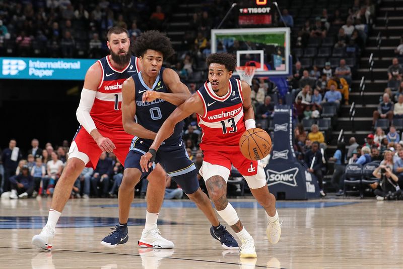 MEMPHIS, TENNESSEE - NOVEMBER 08: Jordan Poole #13 of the Washington Wizards handles the ball against Jaylen Wells #0 of the Memphis Grizzlies during the first half at FedExForum on November 08, 2024 in Memphis, Tennessee. NOTE TO USER: User expressly acknowledges and agrees that, by downloading and or using this photograph, User is consenting to the terms and conditions of the Getty Images License Agreement. (Photo by Justin Ford/Getty Images)