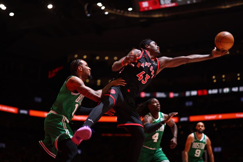 TORONTO, CANADA - JANUARY 15:  Pascal Siakam #43 of the Toronto Raptors grabs a rebound during the game against the Boston Celtics on January 15, 2024 at the Scotiabank Arena in Toronto, Ontario, Canada.  NOTE TO USER: User expressly acknowledges and agrees that, by downloading and or using this Photograph, user is consenting to the terms and conditions of the Getty Images License Agreement.  Mandatory Copyright Notice: Copyright 2024 NBAE (Photo by Vaughn Ridley/NBAE via Getty Images)