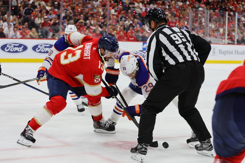 Jun 24, 2024; Sunrise, Florida, USA; Florida Panthers forward Sam Reinhart (13) faces off against Edmonton Oilers forward Leon Draisaitl (29) during the third period in game seven of the 2024 Stanley Cup Final at Amerant Bank Arena. Mandatory Credit: Sam Navarro-USA TODAY Sports