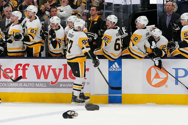 Nov 14, 2023; Columbus, Ohio, USA; Pittsburgh Penguins center Sidney Crosby (87) celebrates his hat trick goal during the third period against the Columbus Blue Jackets at Nationwide Arena. Mandatory Credit: Russell LaBounty-USA TODAY Sports