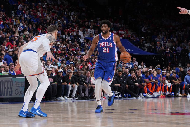 PHILADELPHIA, PA - APRIL 25: Joel Embiid #21 of the Philadelphia 76ers dribbles the ball during the game against the New York Knicks during Round 1 Game 3 of the 2024 NBA Playoffs on April 25, 2024 at the Wells Fargo Center in Philadelphia, Pennsylvania NOTE TO USER: User expressly acknowledges and agrees that, by downloading and/or using this Photograph, user is consenting to the terms and conditions of the Getty Images License Agreement. Mandatory Copyright Notice: Copyright 2024 NBAE (Photo by Jesse D. Garrabrant/NBAE via Getty Images)