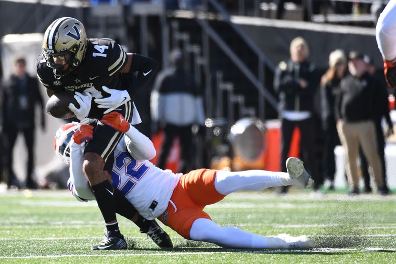 Nov 19, 2022; Nashville, Tennessee, USA; Vanderbilt Commodores wide receiver Will Sheppard (14) catches a pass as he is defended by Florida Gators safety Rashad Torrence II (22) during the first half at FirstBank Stadium. Mandatory Credit: Christopher Hanewinckel-USA TODAY Sports