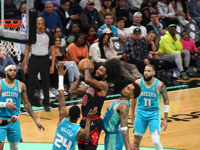 CHARLOTTE, NC - JANUARY 31: Coby White #0 of the Chicago Bulls shoots the ball during the game against the Charlotte Hornets on January 31, 2024 at Spectrum Center in Charlotte, North Carolina. NOTE TO USER: User expressly acknowledges and agrees that, by downloading and or using this photograph, User is consenting to the terms and conditions of the Getty Images License Agreement. Mandatory Copyright Notice: Copyright 2024 NBAE (Photo by Kent Smith/NBAE via Getty Images)