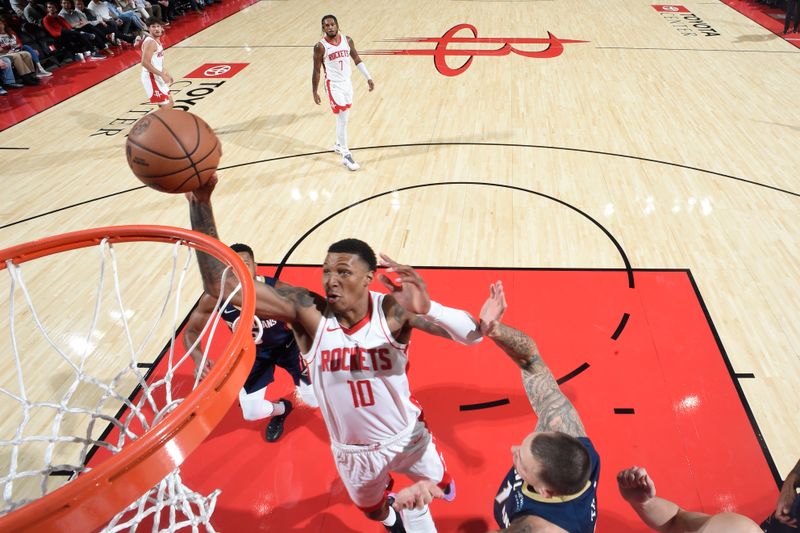 HOUSTON, TX - OCTOBER 15: Jabari Smith Jr. #10 of the Houston Rockets dunks the ball during the game against the New Orleans Pelicans during a NBA preseason game on October 15, 2024 at the Toyota Center in Houston, Texas. NOTE TO USER: User expressly acknowledges and agrees that, by downloading and or using this photograph, User is consenting to the terms and conditions of the Getty Images License Agreement. Mandatory Copyright Notice: Copyright 2024 NBAE (Photo by Logan Riely/NBAE via Getty Images)