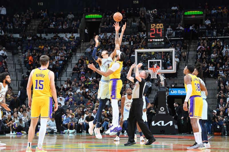 SAN ANTONIO, TX - NOVEMBER 27: Victor Wembanyama #1 of the San Antonio Spurs and Anthony Davis #3 of the Los Angeles Lakers go for the opening tip-off on November 27, 2024 at the Frost Bank Center in San Antonio, Texas. NOTE TO USER: User expressly acknowledges and agrees that, by downloading and or using this photograph, user is consenting to the terms and conditions of the Getty Images License Agreement. Mandatory Copyright Notice: Copyright 2024 NBAE (Photos by Michael Gonzales/NBAE via Getty Images)