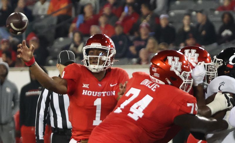 Nov 11, 2023; Houston, Texas, USA; Houston Cougars quarterback Donovan Smith (1) passes against the Cincinnati Bearcats in the first half at TDECU Stadium. Mandatory Credit: Thomas Shea-USA TODAY Sports