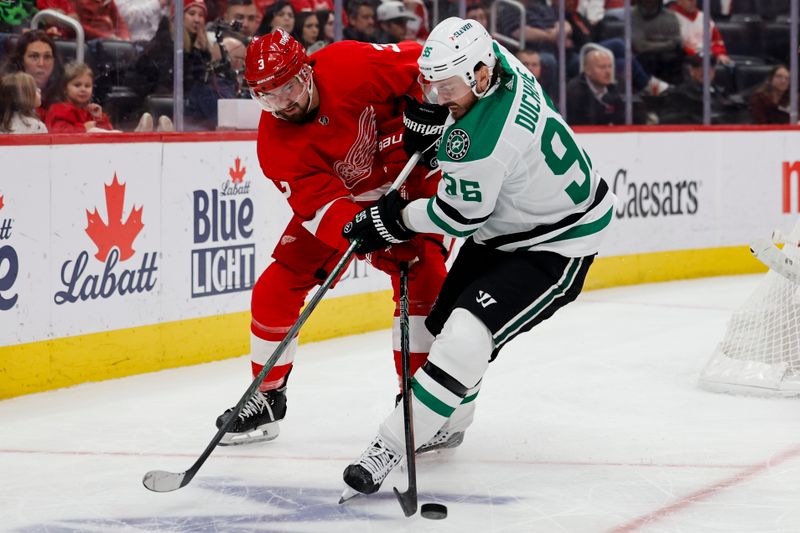 Jan 23, 2024; Detroit, Michigan, USA;  Detroit Red Wings defenseman Justin Holl (3) and Dallas Stars center Matt Duchene (95) battle for the puck in the third period at Little Caesars Arena. Mandatory Credit: Rick Osentoski-USA TODAY Sports