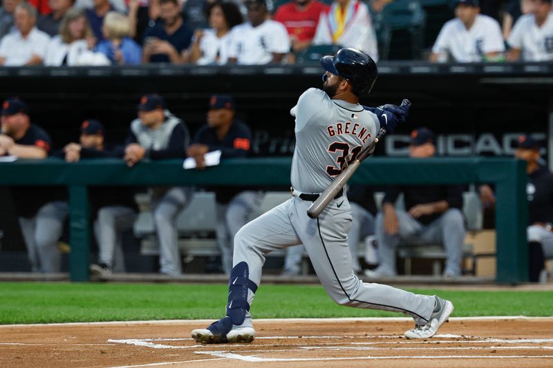 Aug 23, 2024; Chicago, Illinois, USA; Detroit Tigers outfielder Riley Greene (31) hits a double against the Chicago White Sox during the first inning at Guaranteed Rate Field. Mandatory Credit: Kamil Krzaczynski-USA TODAY Sports