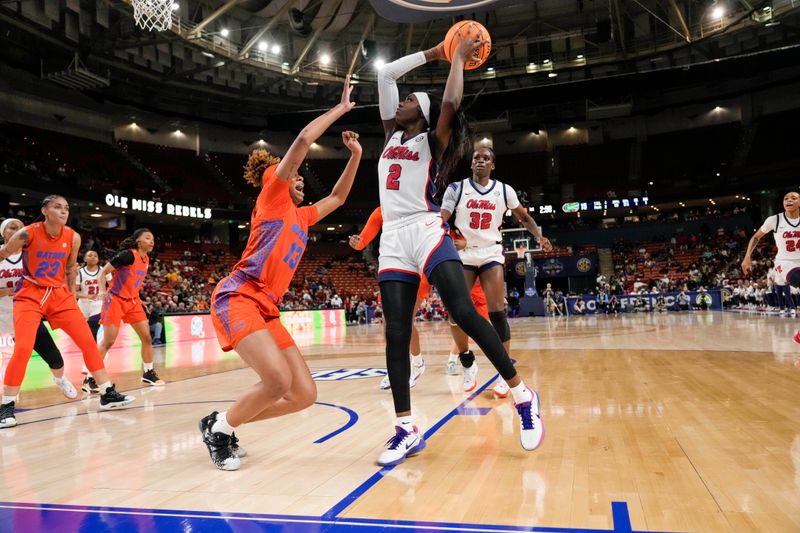 Mar 8, 2024; Greensville, SC, USA; Ole Miss Rebels guard Marquesha Davis (2) takes a jump shot defended by Florida Gators guard Laila Reynolds (13) during the first half at Bon Secours Wellness Arena. Mandatory Credit: Jim Dedmon-USA TODAY Sports