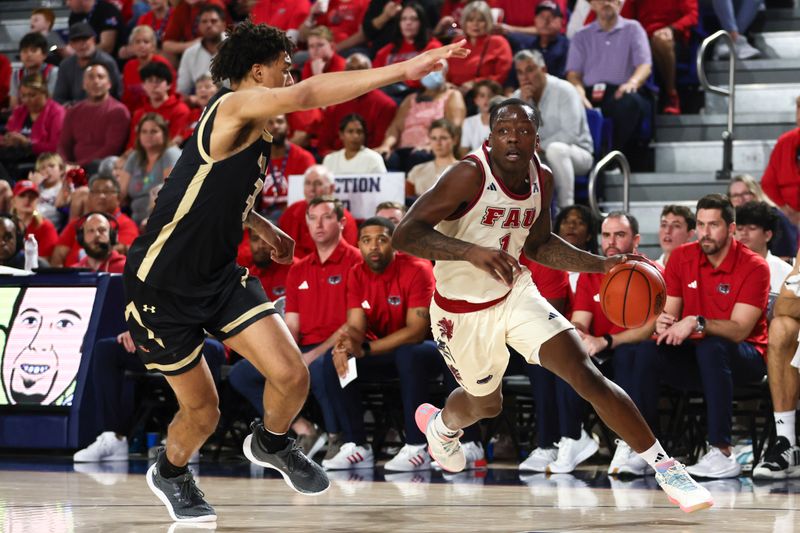 Jan 14, 2024; Boca Raton, Florida, USA; Florida Atlantic Owls guard Johnell Davis (1) drives to the basket against UAB Blazers forward Yaxel Lendeborg (3) during the second half at Eleanor R. Baldwin Arena. Mandatory Credit: Sam Navarro-USA TODAY Sports