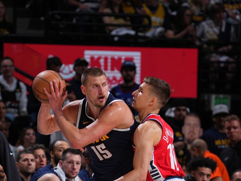 DENVER, CO - APRIL 21:   Bogdan Bogdanovic #10 of the LA Clippers plays defense on Nikola Jokic #15 of the Denver Nuggets during the game  during Round 1 Game 2 of the 2025 NBA Playoffs on April 21, 2025 at Ball Arena in Denver, Colorado. NOTE TO USER: User expressly acknowledges and agrees that, by downloading and/or using this Photograph, user is consenting to the terms and conditions of the Getty Images License Agreement. Mandatory Copyright Notice: Copyright 2025 NBAE (Photo by Garrett Ellwood/NBAE via Getty Images)