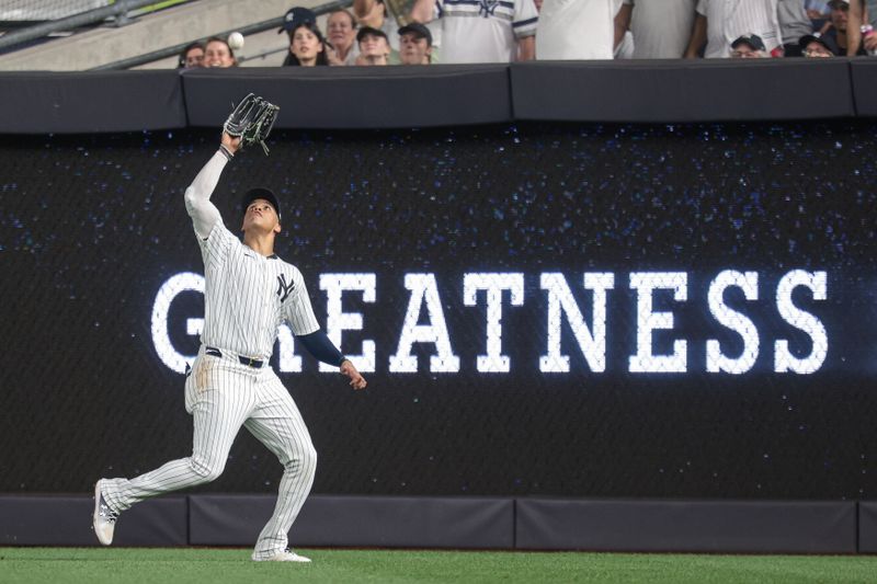 Jun 6, 2024; Bronx, New York, USA; New York Yankees right fielder Juan Soto (22) makes a catch for an out during the fifth inning against the Minnesota Twins at Yankee Stadium. Mandatory Credit: Vincent Carchietta-USA TODAY Sports