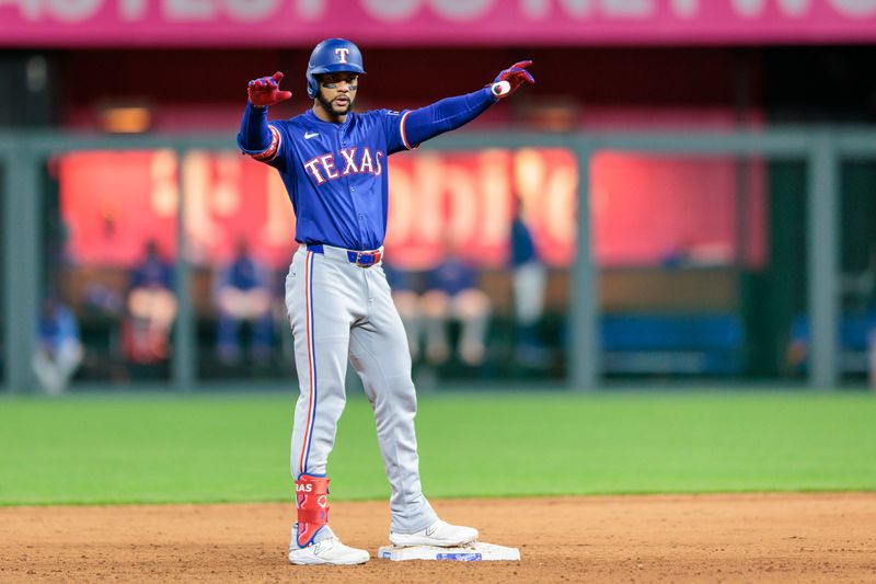 May 4, 2024; Kansas City, Missouri, USA; Texas Rangers outfielder Leody Taveras (3) on second base after hitting a double during the ninth inning against the Kansas City Royals at Kauffman Stadium. Mandatory Credit: William Purnell-USA TODAY Sports