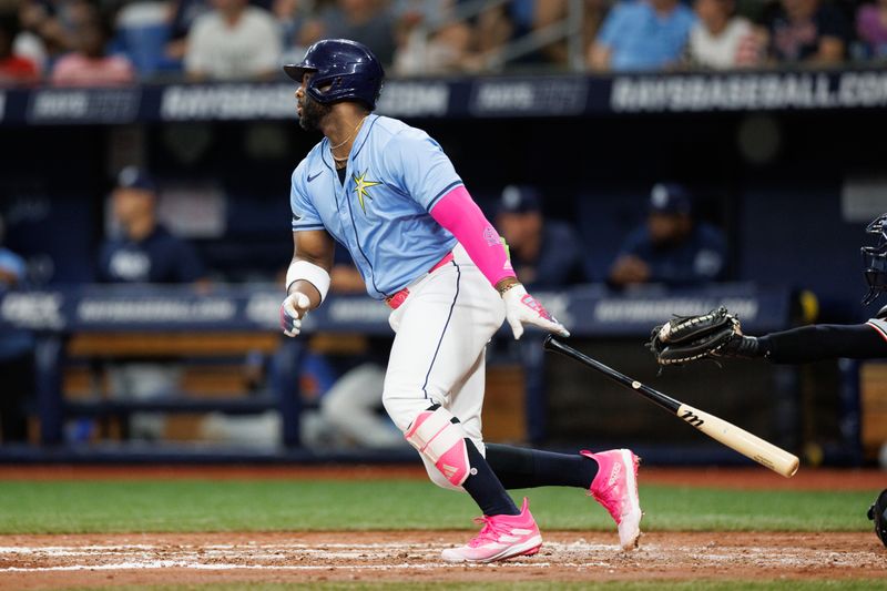 Jun 30, 2024; St. Petersburg, Florida, USA;  Tampa Bay Rays designated hitter Yandy Diaz (2) doubles against the Washington Nationals in the fifth inning at Tropicana Field. Mandatory Credit: Nathan Ray Seebeck-USA TODAY Sports