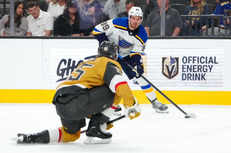 Oct 11, 2024; Las Vegas, Nevada, USA; St. Louis Blues left wing Pavel Buchnevich (89) looks to shoot in front of Vegas Golden Knights defenseman Noah Hanifin (15) during the first period at T-Mobile Arena. Mandatory Credit: Stephen R. Sylvanie-Imagn Images