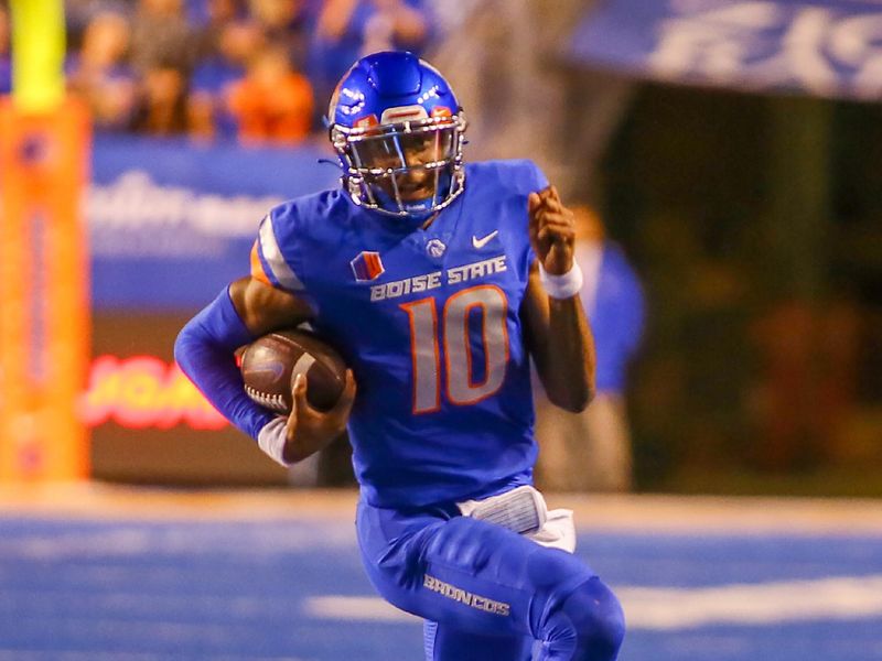 Sep 30, 2022; Boise, Idaho, USA; Boise State Broncos quarterback Taylen Green (10) scores on a 39 yard touchdown run during second half action at Albertsons Stadium against the San Diego State Aztecs. Boise State defeats San Diego State 35-13. Mandatory Credit: Brian Losness-USA TODAY Sports

