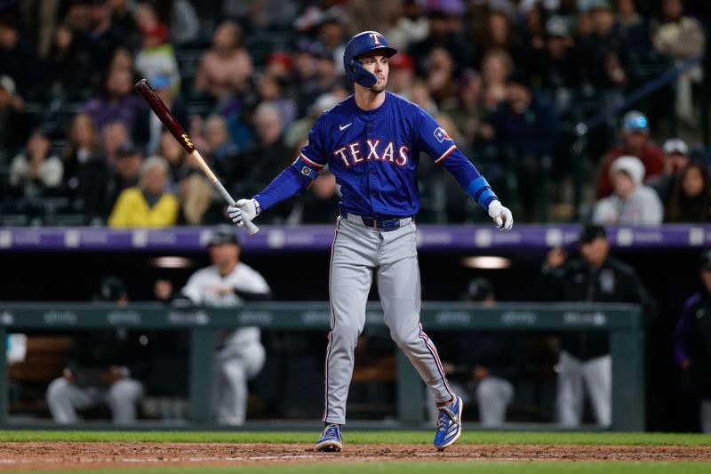 May 10, 2024; Denver, Colorado, USA; Texas Rangers outfielder Evan Carter (32) after striking out in the eighth inning against the Colorado Rockies at Coors Field. Mandatory Credit: Isaiah J. Downing-USA TODAY Sports