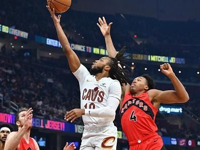 CLEVELAND, OHIO - NOVEMBER 26: Darius Garland #10 of the Cleveland Cavaliers shoots over Scottie Barnes #4 of the Toronto Raptors during the first quarter at Rocket Mortgage Fieldhouse on November 26, 2023 in Cleveland, Ohio. NOTE TO USER: User expressly acknowledges and agrees that, by downloading and or using this photograph, User is consenting to the terms and conditions of the Getty Images License Agreement. (Photo by Jason Miller/Getty Images)