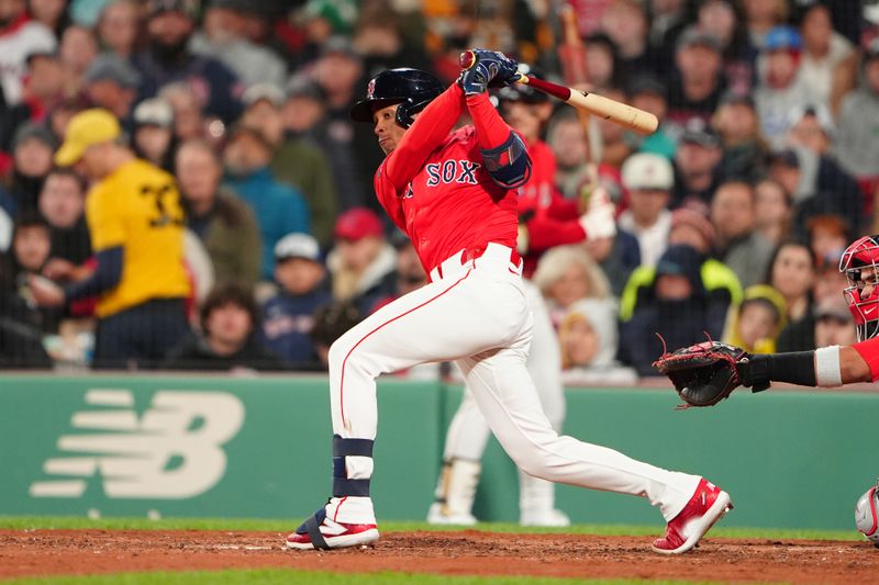 May 10, 2024; Boston, Massachusetts, USA; Boston Red Sox center fielder Ceddanne Rafaela (43) hits an infield single against the Washington Nationals during the fifth inning at Fenway Park. Mandatory Credit: Gregory Fisher-USA TODAY Sports