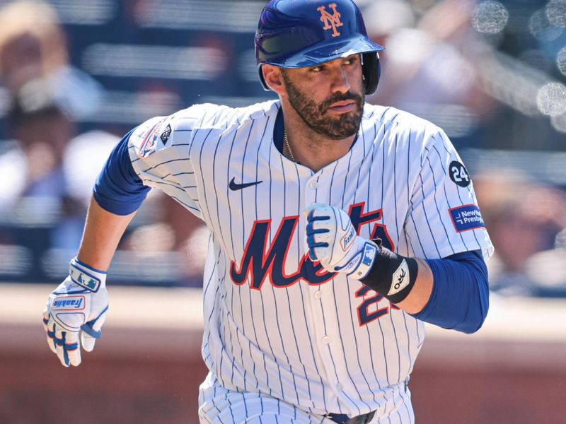 Jul 11, 2024; New York City, New York, USA; New York Mets designated hitter J.D. Martinez (28) singles during the eighth inning against the Washington Nationals at Citi Field. Mandatory Credit: Vincent Carchietta-USA TODAY Sports