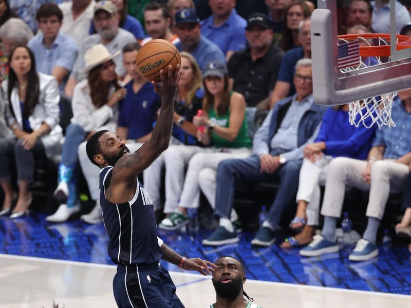 DALLAS, TX - JUNE 12: Kyrie Irving #11 of the Dallas Mavericks drives to the basket during the game against the Boston Celtics during Game 3 of the 2024 NBA Finals on June 12, 2024 at the American Airlines Center in Dallas, Texas. NOTE TO USER: User expressly acknowledges and agrees that, by downloading and or using this photograph, User is consenting to the terms and conditions of the Getty Images License Agreement. Mandatory Copyright Notice: Copyright 2024 NBAE (Photo by Joe Murphy/NBAE via Getty Images)