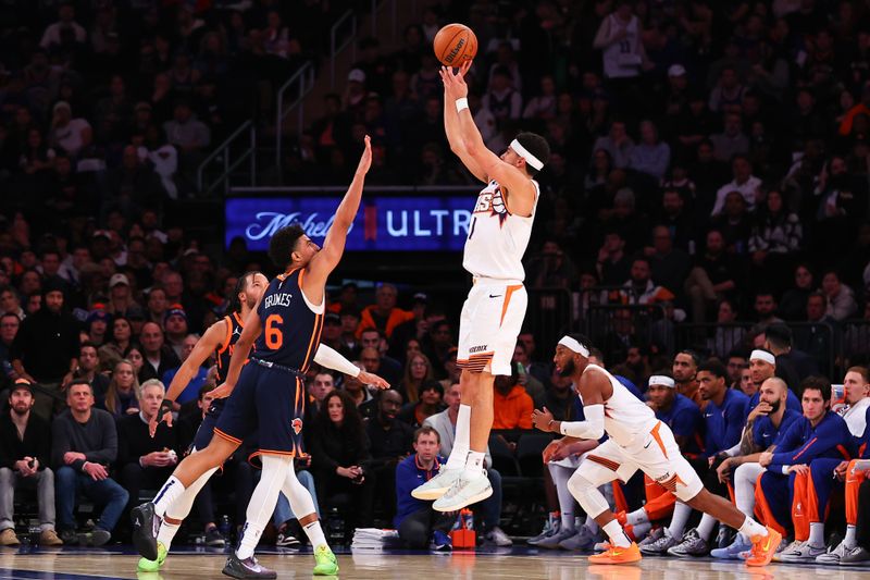 NEW YORK, NY - NOVEMBER 26:  Devin Booker #1 of the Phoenix Suns shoots during the third quarter of the game against the New York Knicks at Madison Square Garden on November 26, 2023 in New York City,New York. NOTE TO USER: User expressly acknowledges and agrees that, by downloading and or using this photograph, User is consenting to the terms and conditions of the Getty Images License Agreement. (Photo by Rich Graessle/Getty Images)