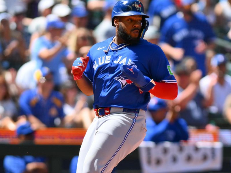 Jul 6, 2024; Seattle, Washington, USA; Toronto Blue Jays first baseman Vladimir Guerrero Jr. (27) scores a run against the Seattle Mariners during the seventh inning at T-Mobile Park. Mandatory Credit: Steven Bisig-USA TODAY Sports