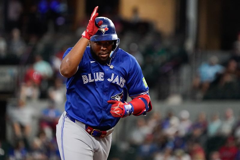 Sep 19, 2024; Arlington, Texas, USA; Toronto Blue Jays first baseman Vladimir Guerrero Jr. (27) reacts after hitting a solo home run during the ninth inning against the Texas Rangers at Globe Life Field. Mandatory Credit: Raymond Carlin III-Imagn Images