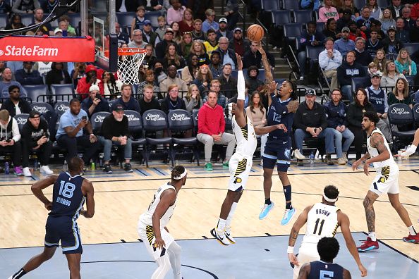 MEMPHIS, TN - DECEMBER 21: Ja Morant #12 of the Memphis Grizzlies shoots the ball during the game against the Indiana Pacers on December 21, 2023 at FedExForum in Memphis, Tennessee. NOTE TO USER: User expressly acknowledges and agrees that, by downloading and or using this photograph, User is consenting to the terms and conditions of the Getty Images License Agreement. Mandatory Copyright Notice: Copyright 2023 NBAE (Photo by Joe Murphy/NBAE via Getty Images)