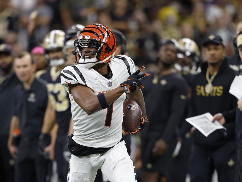 Cincinnati Bengals wide receiver Ja'Marr Chase (1) runs the ball during an NFL football game against the New Orleans Saints, Sunday, Oct. 16, 2022, in New Orleans. (AP Photo/Tyler Kaufman)