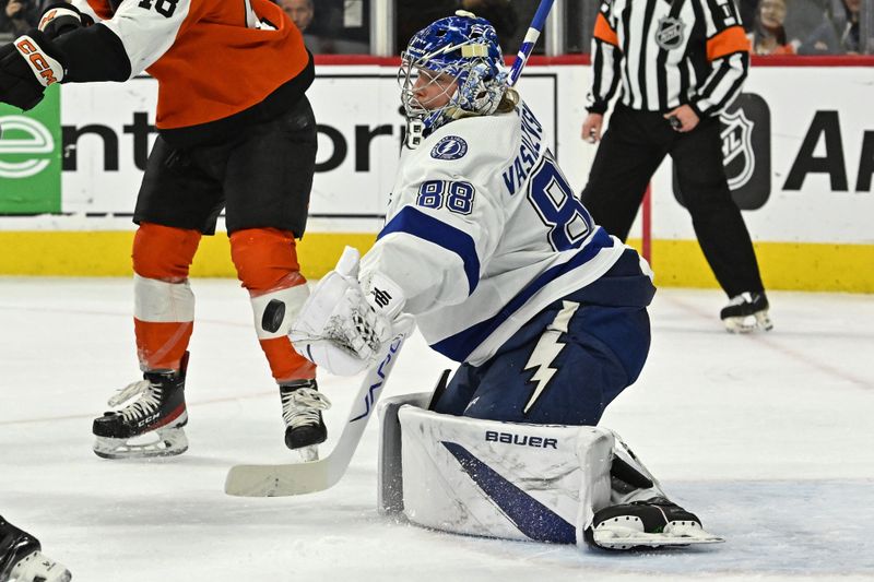 Jan 23, 2024; Philadelphia, Pennsylvania, USA;  Tampa Bay Lightning goaltender Andrei Vasilevskiy (88) makes a save against Philadelphia Flyers during the first period at Wells Fargo Center. Mandatory Credit: Eric Hartline-USA TODAY Sports