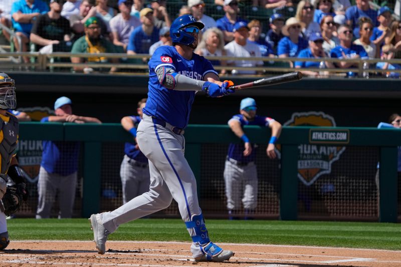 Mar 10, 2024; Mesa, Arizona, USA; Kansas City Royals first baseman Vinnie Pasquantino (9) hits against the Oakland Athletics in the first inning at Hohokam Stadium. Mandatory Credit: Rick Scuteri-USA TODAY Sports