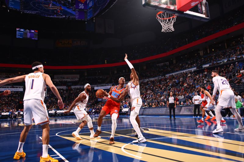 OKLAHOMA CITY, OK - NOVEMBER 15: Shai Gilgeous-Alexander #2 of the Oklahoma City Thunder drives to the basket during the game against the Phoenix Suns during the Emirates NBA Cup game on November 15, 2024 at Paycom Center in Oklahoma City, Oklahoma. NOTE TO USER: User expressly acknowledges and agrees that, by downloading and or using this photograph, User is consenting to the terms and conditions of the Getty Images License Agreement. Mandatory Copyright Notice: Copyright 2024 NBAE (Photo by Zach Beeker/NBAE via Getty Images)