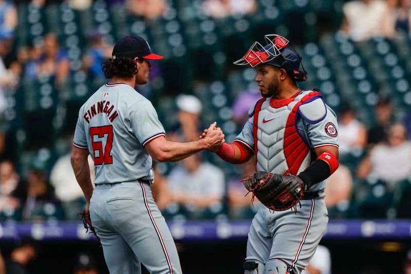 Jun 23, 2024; Denver, Colorado, USA; Washington Nationals relief pitcher Kyle Finnegan (67) reacts with catcher Keibert Ruiz (20) after the game against the Colorado Rockies at Coors Field. Mandatory Credit: Isaiah J. Downing-USA TODAY Sports