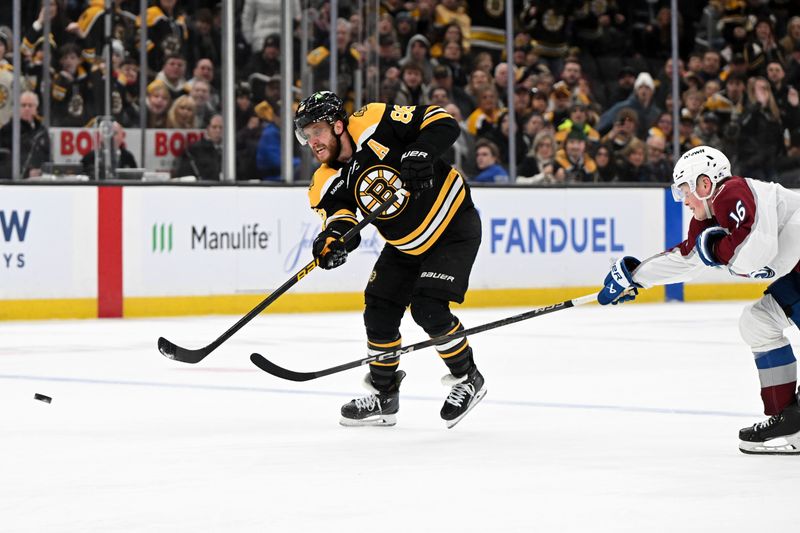 Jan 25, 2025; Boston, Massachusetts, USA; Boston Bruins right wing David Pastrnak (88) shoots and scores an empty net goal against the Colorado Avalanche during the third period at the TD Garden. Mandatory Credit: Brian Fluharty-Imagn Images