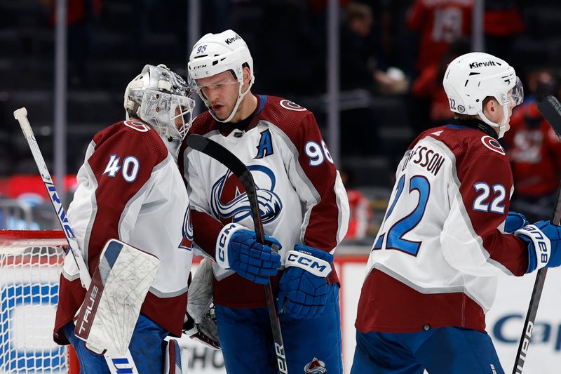 Feb 13, 2024; Washington, District of Columbia, USA; Colorado Avalanche goaltender Alexandar Georgiev (40) celebrates wth Colorado Avalanche right wing Mikko Rantanen (96) after their game against the Washington Capitals at Capital One Arena. Mandatory Credit: Geoff Burke-USA TODAY Sports