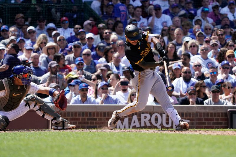 May 19, 2024; Chicago, Illinois, USA; Pittsburgh Pirates second base Nick Gonzales (39) hits a two-run single against the Chicago Cubs during the fifth inning at Wrigley Field. Mandatory Credit: David Banks-USA TODAY Sports