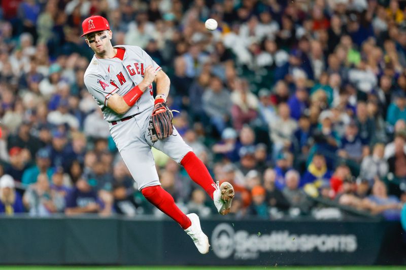 Sep 12, 2023; Seattle, Washington, USA; Los Angeles Angels shortstop Zach Neto (9) throws to first base for a groundout against the Seattle Mariners during the sixth inning at T-Mobile Park. Mandatory Credit: Joe Nicholson-USA TODAY Sports