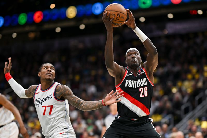 SEATTLE, WASHINGTON - OCTOBER 11: Duop Reath #26 of the Portland Trail Blazers grabs a rebound against Kevin Porter Jr. #77 of the LA Clippers during the third quarter of the Rain City Showcase game at Climate Pledge Arena on October 11, 2024 in Seattle, Washington. The LA Clippers won 101-99. NOTE TO USER: User expressly acknowledges and agrees that, by downloading and or using this photograph, User is consenting to the terms and conditions of the Getty Images License Agreement. (Photo by Alika Jenner/Getty Images)