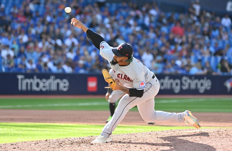 Aug 27, 2023; Toronto, Ontario, CAN;  Cleveland Guardians relief pitcher Emmanuel Clase (48) delivers a pitch against the Toronto Blue Jays in the 11th inning at Rogers Centre. Mandatory Credit: Dan Hamilton-USA TODAY Sports