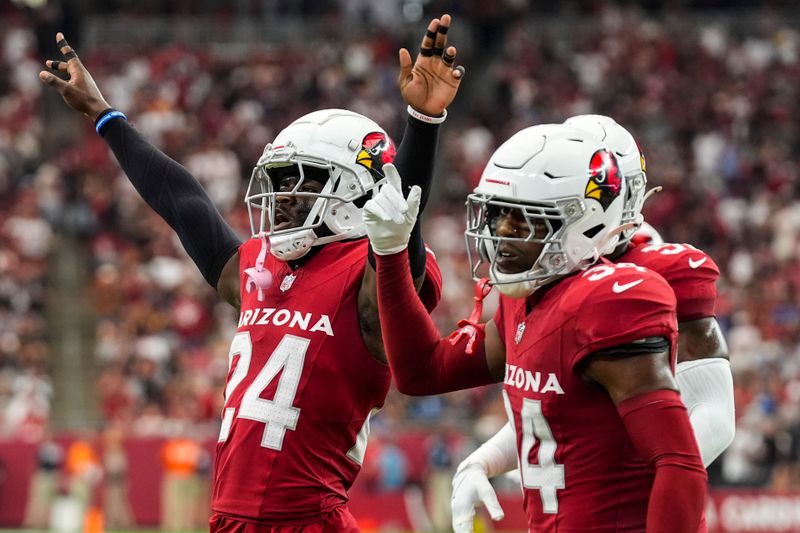 Arizona Cardinals cornerback Starling Thomas V (24) celebrate a defensive play against the Los Angeles Rams during the first half of an NFL football game, Sunday, Sept. 15, 2024, in Glendale, Ariz. (AP Photo/Ross D. Franklin)