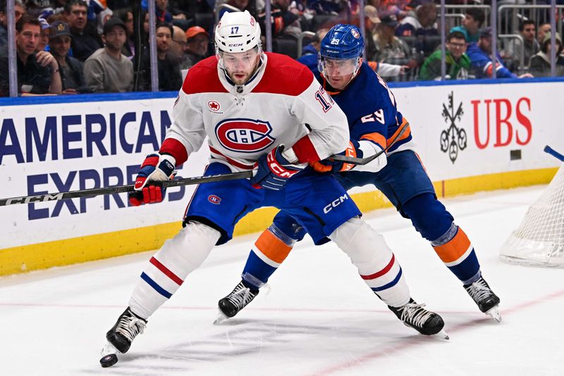 Apr 11, 2024; Elmont, New York, USA; New York Islanders center Brock Nelson (29) defends against Montreal Canadiens right wing Josh Anderson (17) during the third period at UBS Arena. Mandatory Credit: Dennis Schneidler-USA TODAY Sports