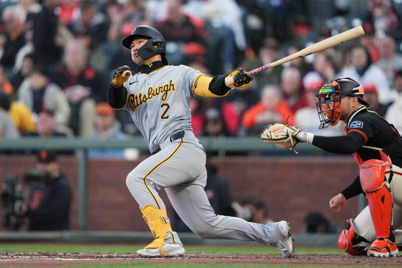 Apr 27, 2024; San Francisco, California, USA; Pittsburgh Pirates right fielder Connor Joe (2) hits a double against the San Francisco Giants during the fourth inning at Oracle Park. Mandatory Credit: Darren Yamashita-USA TODAY Sports