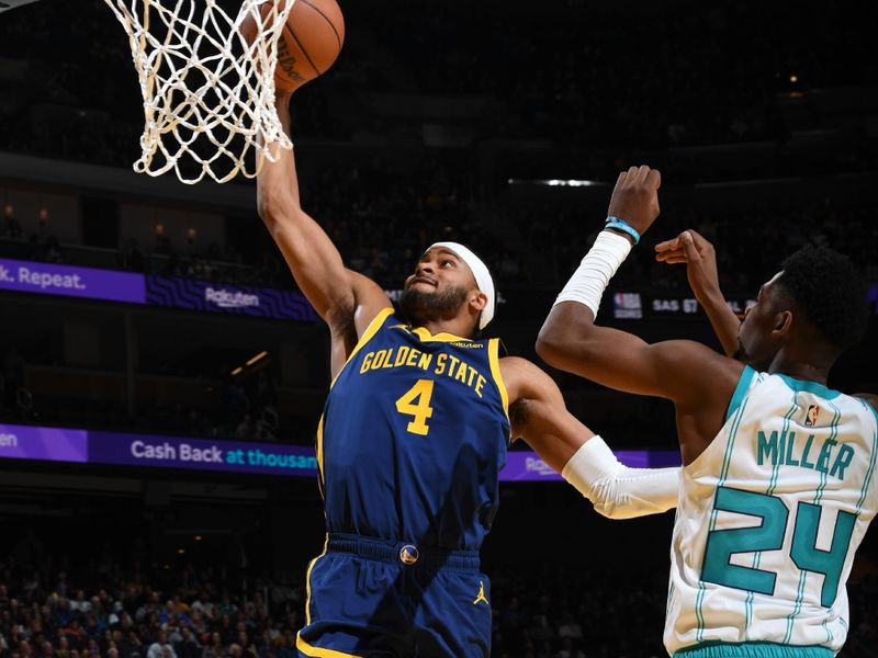 SAN FRANCISCO, CA - FEBRUARY 23: Moses Moody #4 of the Golden State Warriors ddrives to the basket during the game against the Charlotte Hornets on February 23, 2024 at Chase Center in San Francisco, California. NOTE TO USER: User expressly acknowledges and agrees that, by downloading and or using this photograph, user is consenting to the terms and conditions of Getty Images License Agreement. Mandatory Copyright Notice: Copyright 2024 NBAE (Photo by Noah Graham/NBAE via Getty Images)