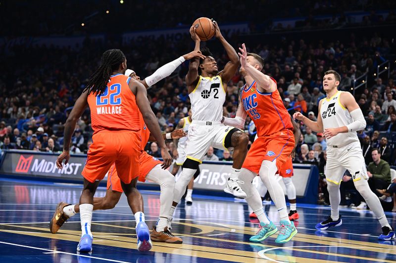 OKLAHOMA CITY, OKLAHOMA - DECEMBER 3: Collin Sexton #2 of the Utah Jazz goes up for a shot while being defended by Isaiah Hartenstein #55 of the Oklahoma City Thunder during the first half at Paycom Center on December 3, 2024 in Oklahoma City, Oklahoma. NOTE TO USER: User expressly acknowledges and agrees that, by downloading and or using this photograph, User is consenting to the terms and conditions of the Getty Images License Agreement. (Photo by Joshua Gateley/Getty Images)