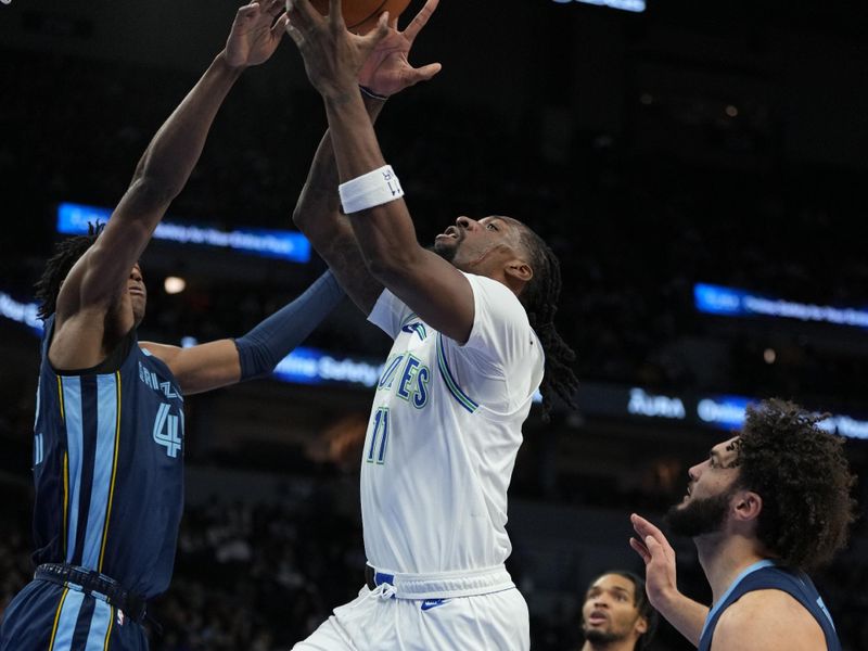 MINNEAPOLIS, MN -  JANUARY 18: Naz Reid #11 of the Minnesota Timberwolves shoots the ball during the game against the Memphis Grizzlies on January 18, 2024 at Target Center in Minneapolis, Minnesota. NOTE TO USER: User expressly acknowledges and agrees that, by downloading and or using this Photograph, user is consenting to the terms and conditions of the Getty Images License Agreement. Mandatory Copyright Notice: Copyright 2024 NBAE (Photo by Jordan Johnson/NBAE via Getty Images)